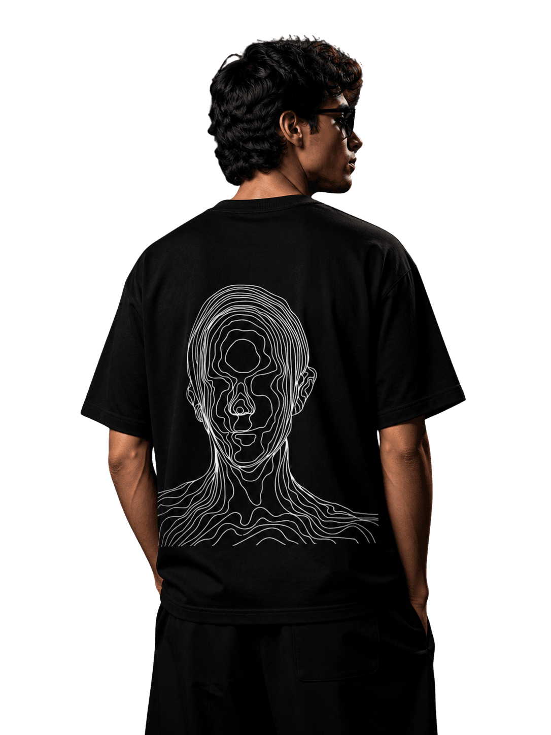 Model showing line-art face design on the back of a black THREEFOLD t-shirt
